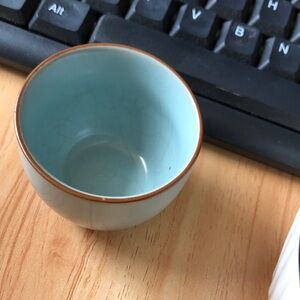 Light Blue Ceramic Teacup with Brown Rim